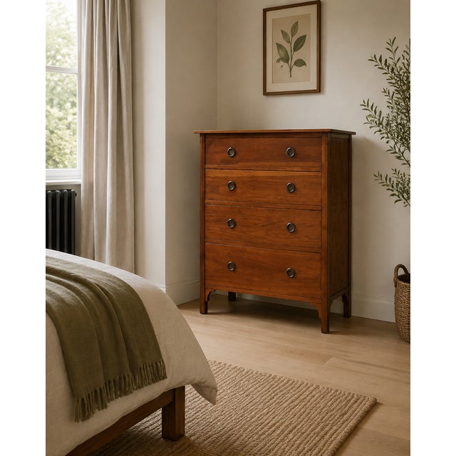 An Edwardian oak tallboy chest dating from circa 1910, featuring a Georgian-style design. The chest has four graduated...