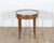 An elegant Louis XVI-style bouillotte table from France, dating to the late 19th century, finely crafted in mahogany with...