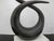 Interlude Home modernist style sculpture. Twisted metal sculpture on attached to white marble base. Base stickers "India...