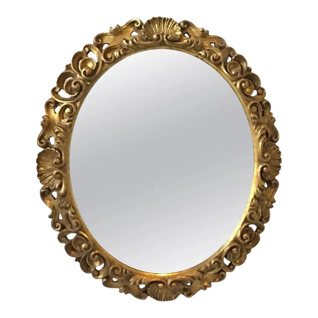 1930s Italian Carved Gilt Wood Shell Motif Oval Mirror For Sale