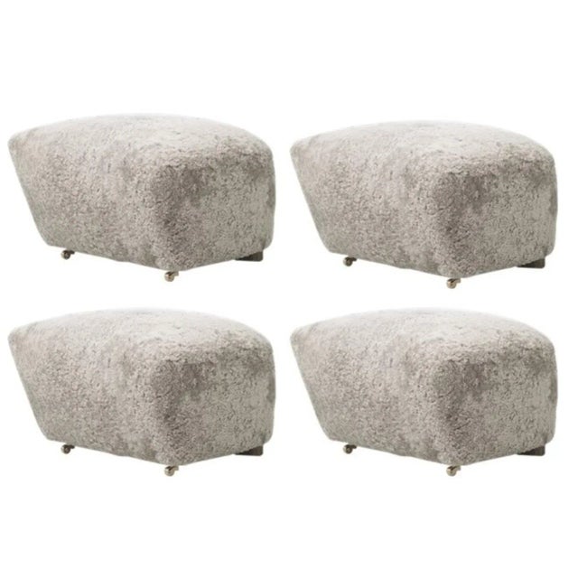 Set Of 4 green tea smoked oak sheepskin the tired man footstools by Lassen. Dimensions: W 55 x D 53 x H 36 cm Materials:...