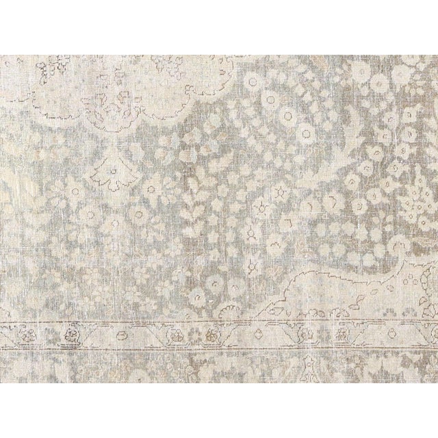 This 8'7" x 12' Semi Antique Persian Tabriz Rug is a beautiful and durable addition to any room. Made with high quality...