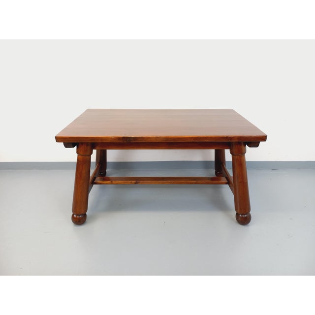 Vintage rectangular dining table from the 1950s/60s, made of solid dark pine, French design attributed to Georges Robert,...