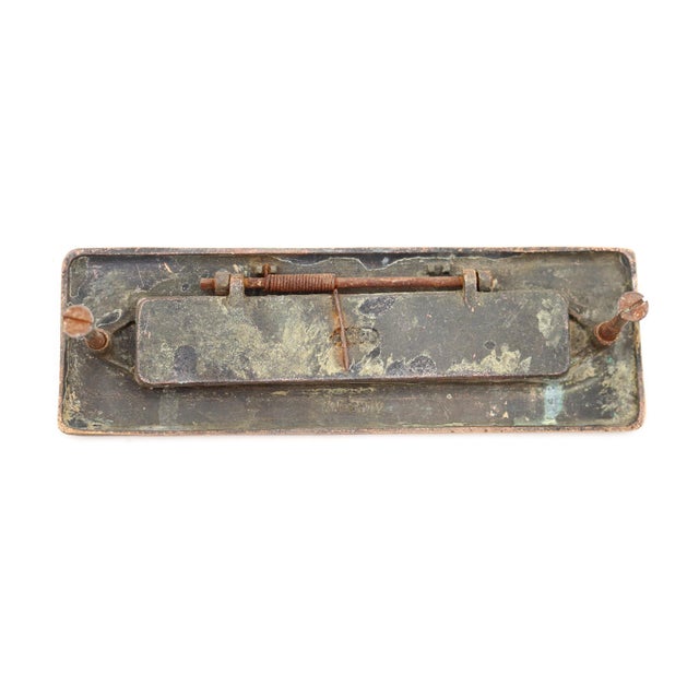 Vintage brass spring loaded mail slot that opens inward at 45 degrees to allow mail through. Mounting screws are included....