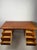 Original Danish teak desk from the 1960s, designed in the characteristic Scandinavian Modern aesthetic. The clean,...