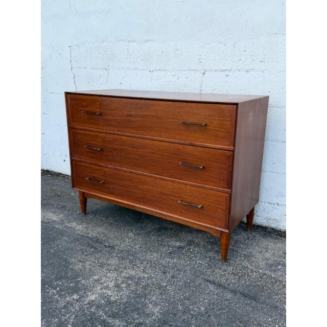 This magnificent Small Dresser is made of wood, walnut, and veneer. The dresser was made by Ramseur Furniture and it is...