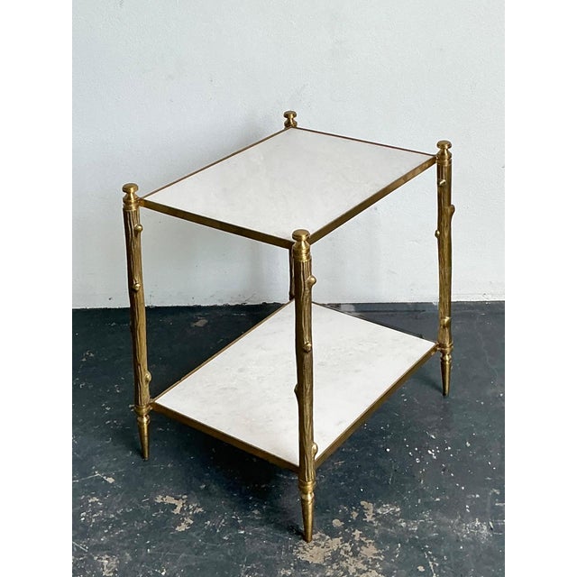 This elegant vintage brass faux bois two-tier table by Global Views reflects the brand’s signature blend of refined...