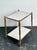 This elegant vintage brass faux bois two-tier table by Global Views reflects the brand’s signature blend of refined...