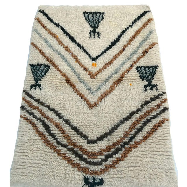 Moroccan Azilal rug handwoven with ivory, brown and black high pile wool in a tribal Berber design . Dimensions: 2'8 x 3'11