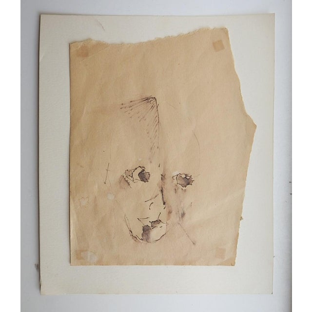Mid 20th century pen and ink on tan paper modernist portrait study of face. Unsigned. Unframed, mounted on cardstock...