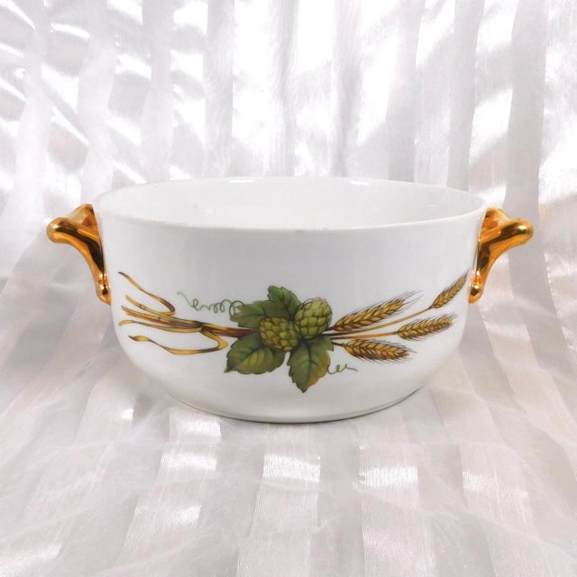This is a Royal Worcester round casserole dish with no lid in Eversham Gold from 1961. It was made in England. It has a...