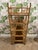 This Bamboo etagere has 5 shelves 7.5" apart. It also has brass casters for easy movement and detailed brass ball finials....