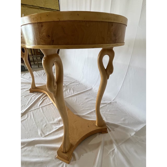 This striking 1980s Italian kidney-shaped console table is crafted in richly figured burl wood veneer, displaying the...