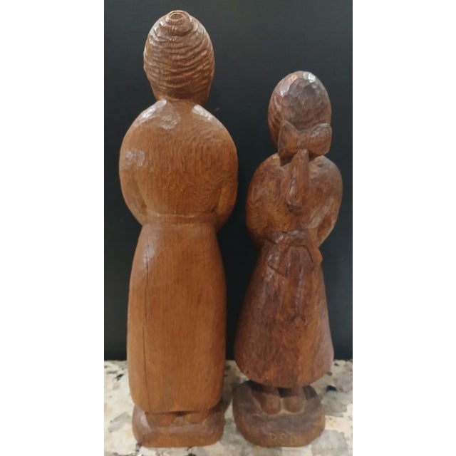 From the 1940's this is a rare pair of John Rood Solid oak carved figures. The larger figure is titled "The Neighbor" and...