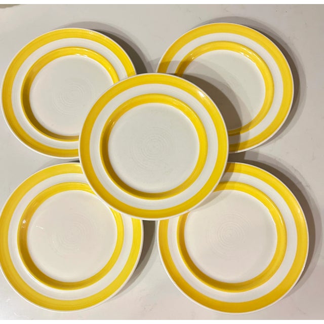 As bright as the California sunshine, these vintage salad plates feature two thick yellow outer rings on a creamy white...