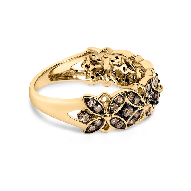 Discover the subtle elegance embodied in this exquisite band that melds the rich allure of 10K yellow gold-plated .925...