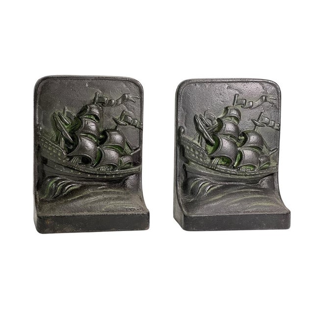 Maritime Cast Iron Bookends with Ships and Sea Motif A striking pair of cast iron bookends featuring a maritime theme with...