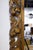 A large, carved Italian Florentine giltwood mirror featuring a bold shell and acanthus pediment and a pierced foliate...