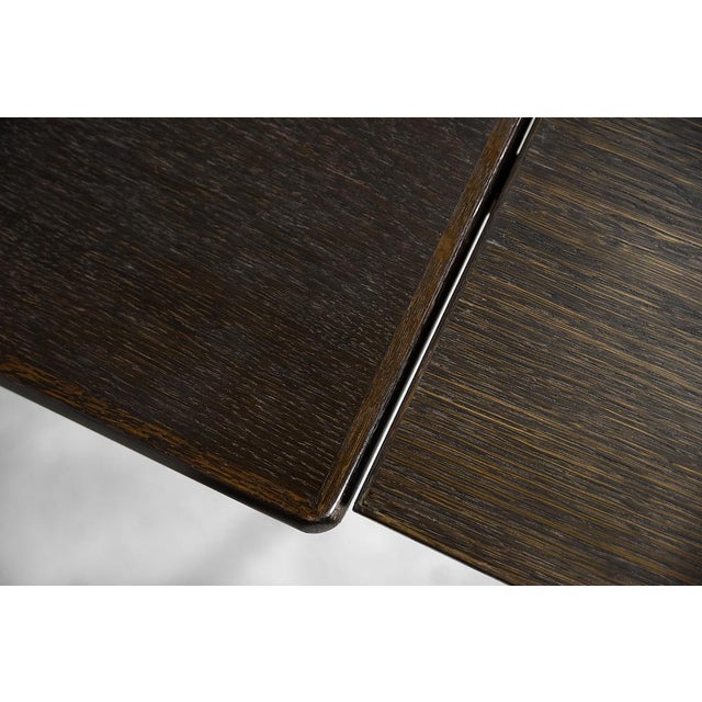 This classic dining table was produced by the Danish manufactory AM Møbler [Ansager Møbler] during the 1960s. It is made...