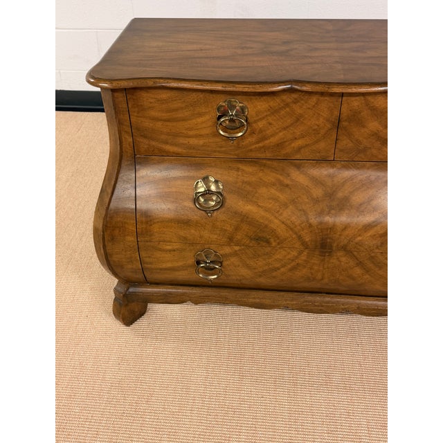 Beautiful Bombay Chest of Drawers from Baker Furniture. Spectacular Door pulls and book matched veneers. Condition...
