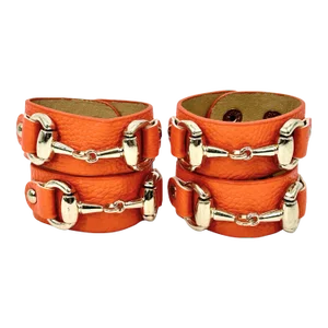 Set of 4 Orange Leather Napkin Rings With Horsebit Detail by Julian Mejia Design