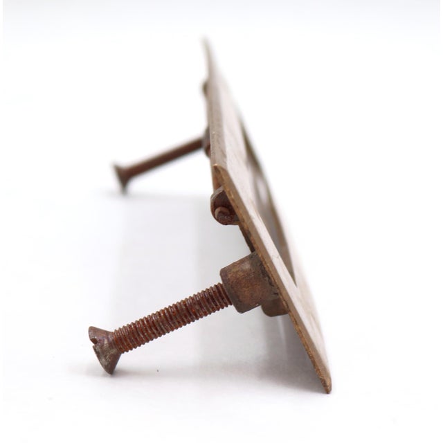 Vintage spring loaded mail slot that opens inward at 45 degrees to allow mail through. Made of brass with a patina finish....