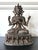 A finely cast bronze statue of Avalokiteshvara in his four-arm form with gilt and polychrome surface. The Bodhisattva of...