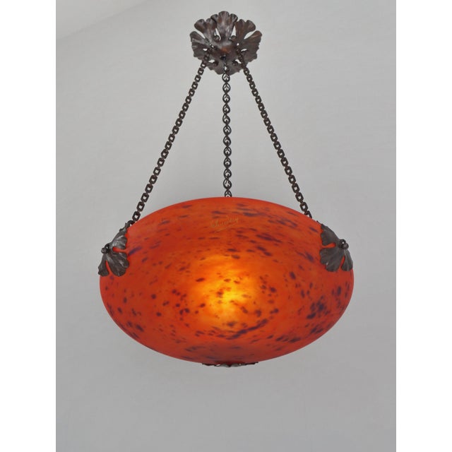 CHARLES SCHNEIDER A wonderful 1925 French art deco hanging fixture in wrought iron holding a nice Schneider shade in...