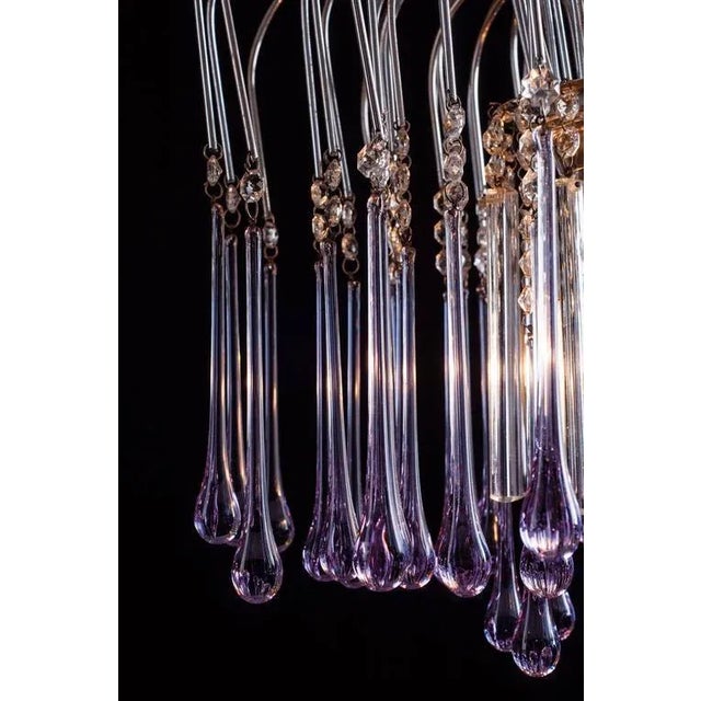 Wonderful fountain of light made by dozens of violet droplets and ice crystals. Measures: Height without chain 45 cm.,...