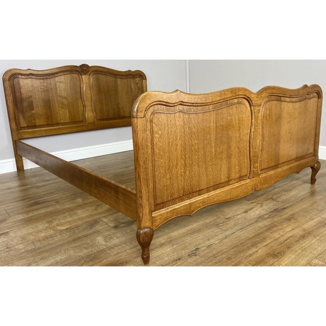 This elegant Vintage French Louis double bed frame features a warm oak finish with beautifully shaped headboard and...