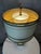 An elegant Empire-style table lamp dating from the 1920s, crafted from cream lacquered metal and enhanced with delicate...