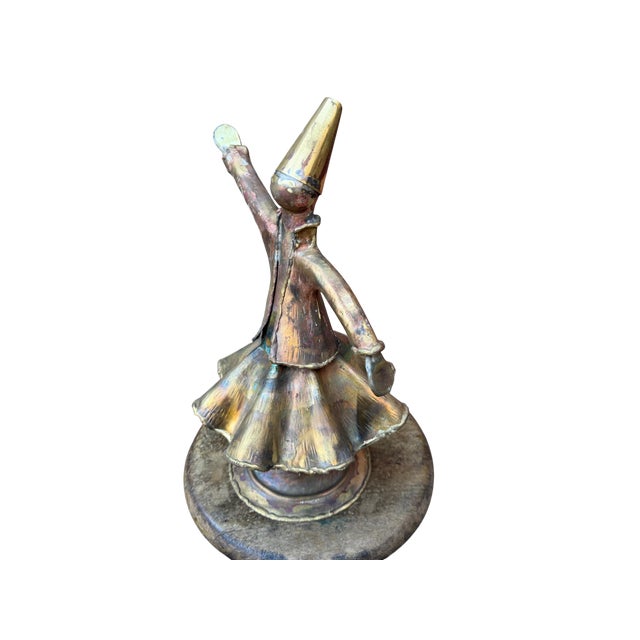 Raw Forged Brass Whirling Dervish Capturing the eternal rotation of the Sufi meditation, the raw brass of the dervish is...