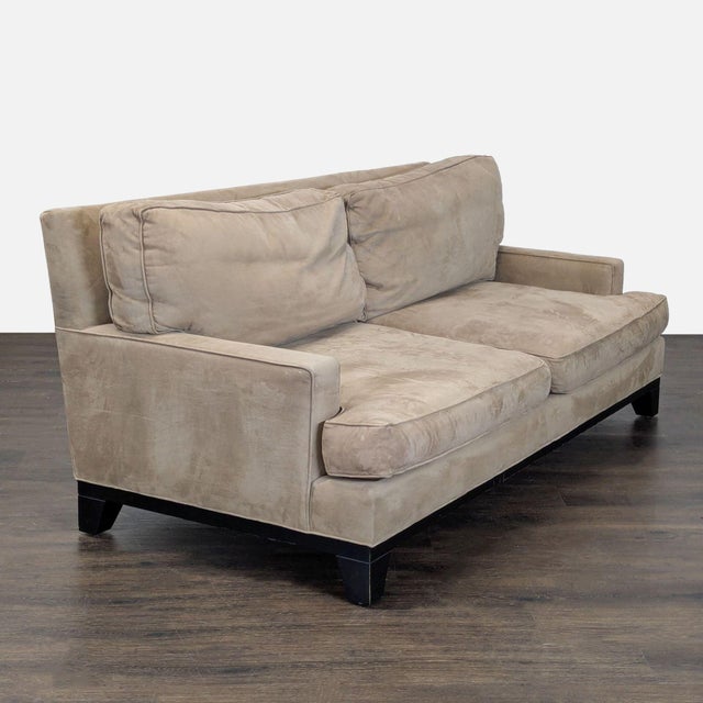 This Pottery Barn 3-seat sofa features a soft beige fabric and comfortable removable back and seat cushions. The clean...