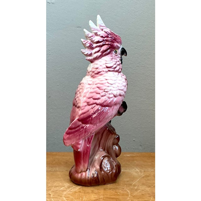 A vintage ceramic cockatoo figurine, this piece showcases a vibrant glaze that accentuates its intricate detailing....