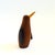 A mid century turned wood figurine in the shape of a Penguin. Adorable stylized features. Wings are made of plastic. Made...