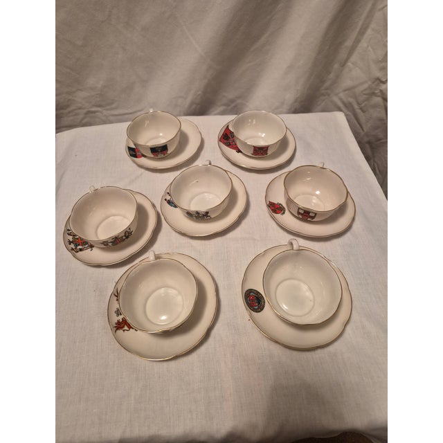 Set of seven antique porcelain demitasse China cups and saucers. Manufactured by W.H. Goss at Falcon Pottery Works in...