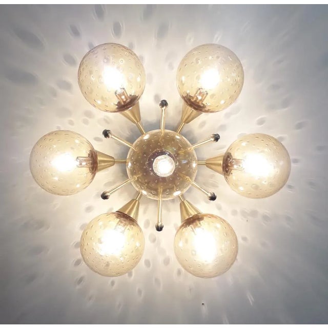Italian flush mount with seven amber bubbles Murano glass globes carefully hand blown with bubbles inside the glass using...
