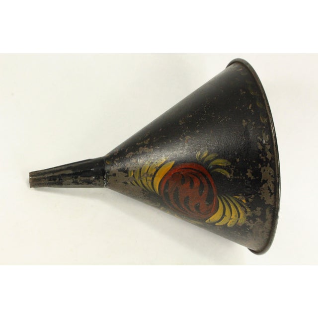 An early and RARE tin toleware kitchen tool A large funnel, charmingly decorated with hand painted floral motifs over...