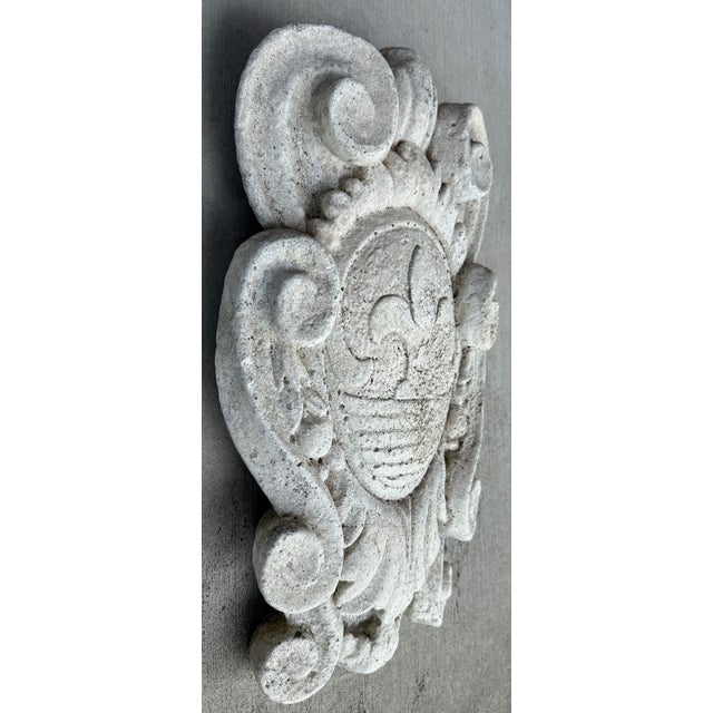 This decorative Italian "Stemma Con Giglio" relief wall plaque features a fleur-de-lis motif and is crafted from a durable...