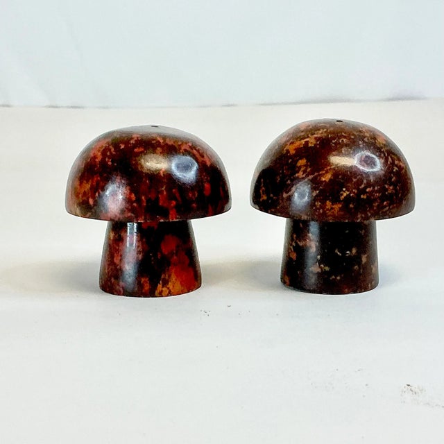 This pair of deep brown-chestnut-oxblood Italian Marble Mushroom Salt & Pepper Shakers are from the 1970s. They are...