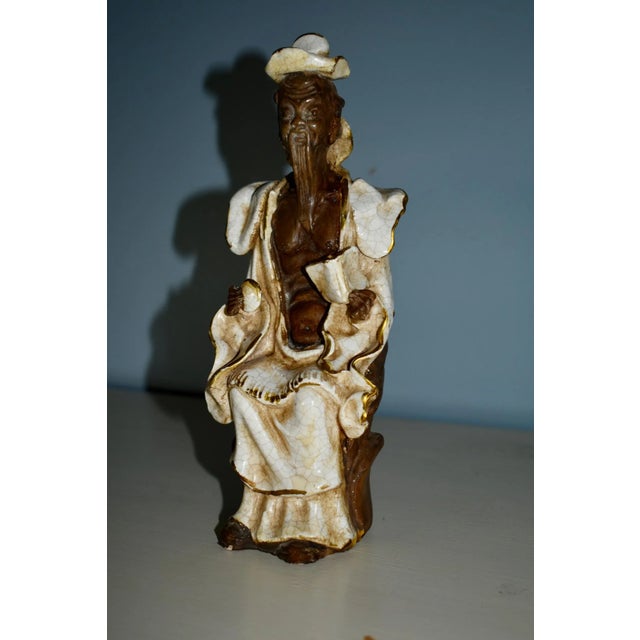 Vintage (1950's) Pair of Asian Statues. Made in Italy. Ceramic. Shades of Brown, Crean, and Tan. The Measurements: Man:...