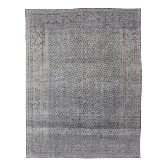 Distressed Persian Antique Tabriz Carpet With Muted Floral Design in Light Gray For Sale