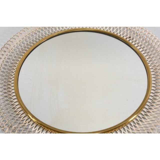 Mid-Century Modern wall mirror from the 1950s. It was manufactured by the renowned Vereinigte Werkstätten (Germany) and is...
