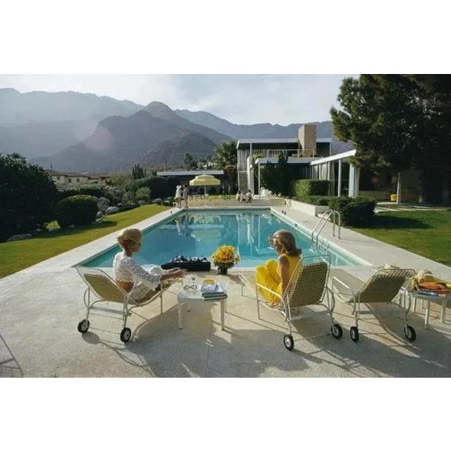 Poolside Pairs 1970 by Slim Aarons Slim Aarons Limited Estate Edition Former fashion model Helen Dzo Dzo Kaptur (in white...
