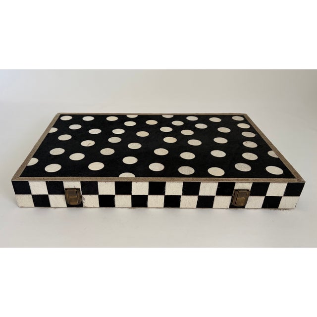 Game night gets the unmistakable MacKenzie-Childs treatment with this striking folding backgammon set. The case is wrapped...