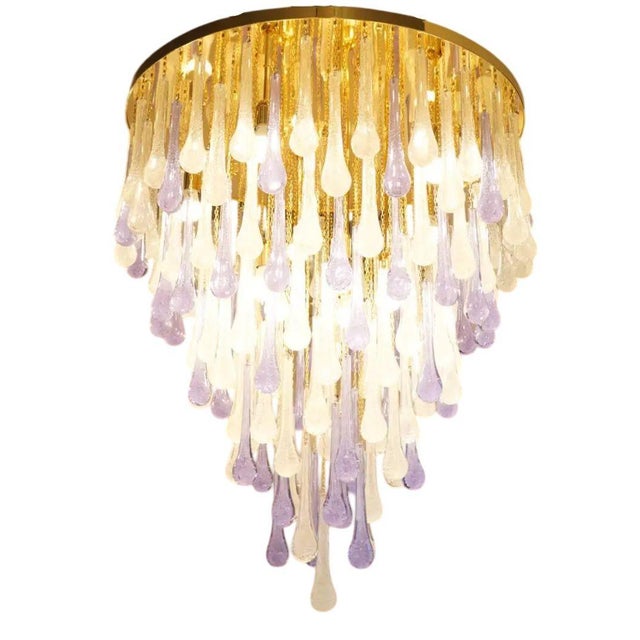 A stunning flush mount glass chandelier, designed by Franco Luce in 1980, featuring over 100+ hand-blown Pulegoso and...