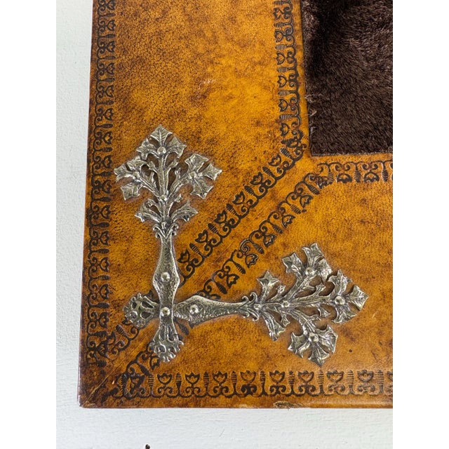 This is a vintage hand tooled leather parchment book by Maitland Smith. This book has light brown hand tooled leather...