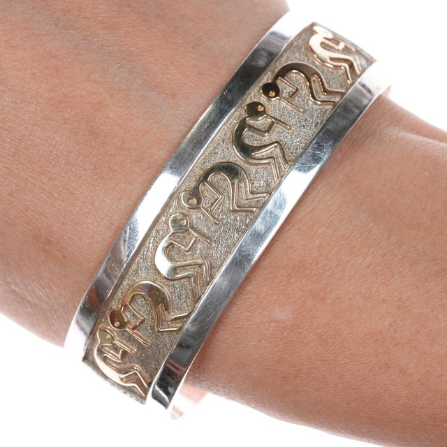 6.75" Robert Taylor Navajo Sterling/14k gold kokopelli cuff bracelet. Solid 14k gold Kokopelli's. No issues, weight and...