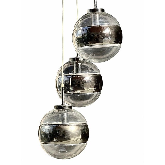 An elegant modernist pendant light produced in the 1970s by the prestigious German glass manufacturer Peill & Putzler....