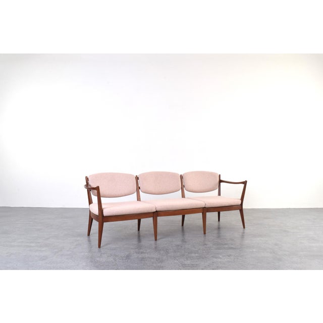 This three-seater "Kaminstolen" sofa was designed in the 1950s by Norwegian designers Fredrik Kayser and Adolf Relling and...